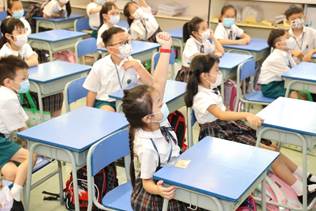 A group of children in a classroom Description automatically generated with medium confidence